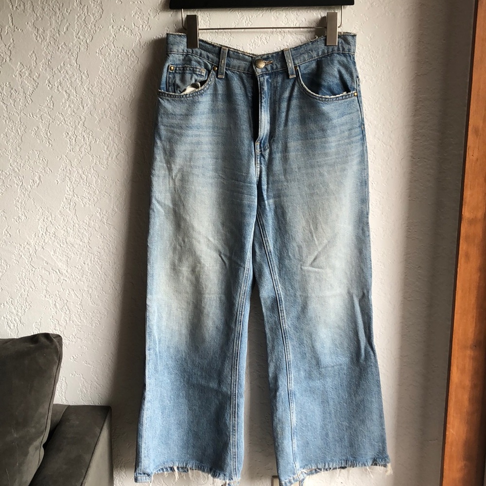 The rider jean. Distressed wide leg denim